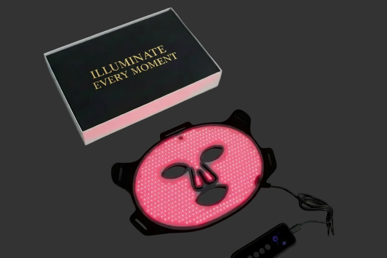 AURELIA ÆTHER Red Light Therapy Face Mask with handheld controller on a clean grey background.